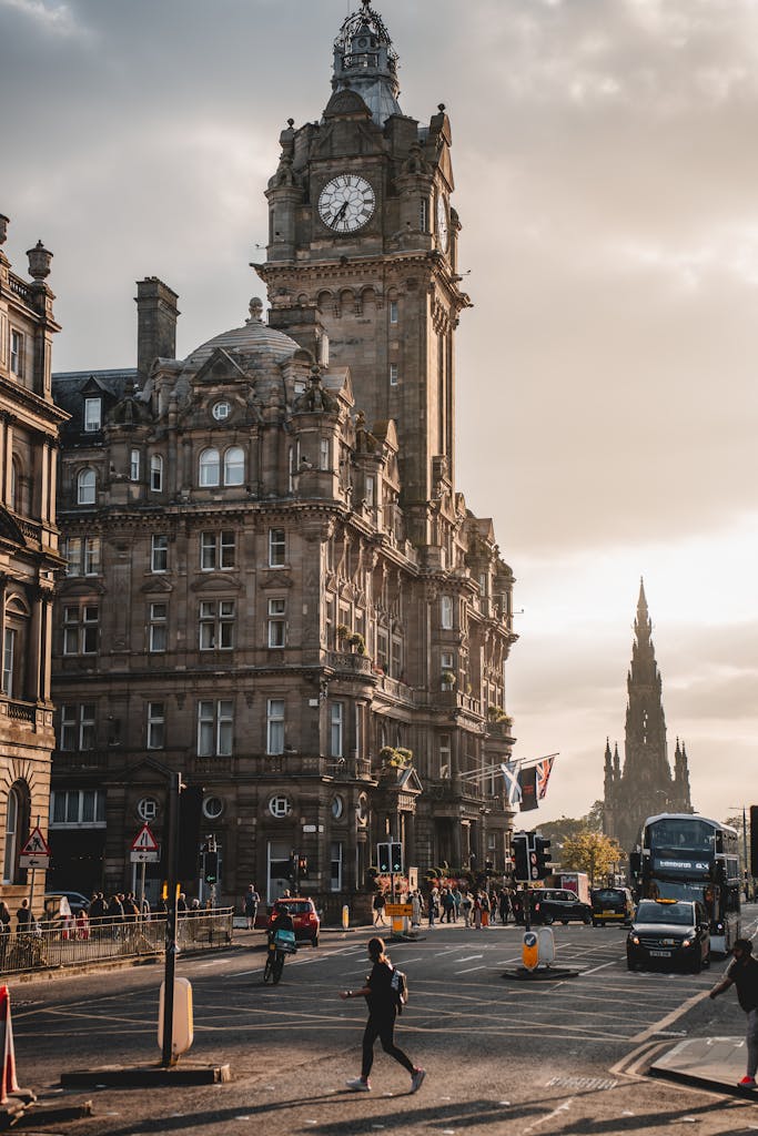Iconic view of Edinburgh's Balmoral Hotel and Scott Monument at sunset